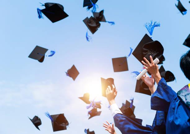 Graduates throwing hats in the air